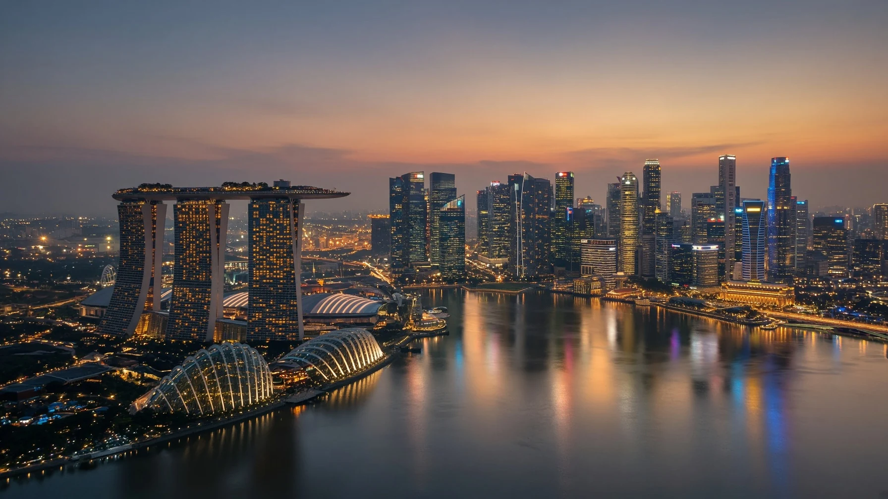 Marina Bay at dusk. Marina Bay Sands and the SkyPark are on the left.